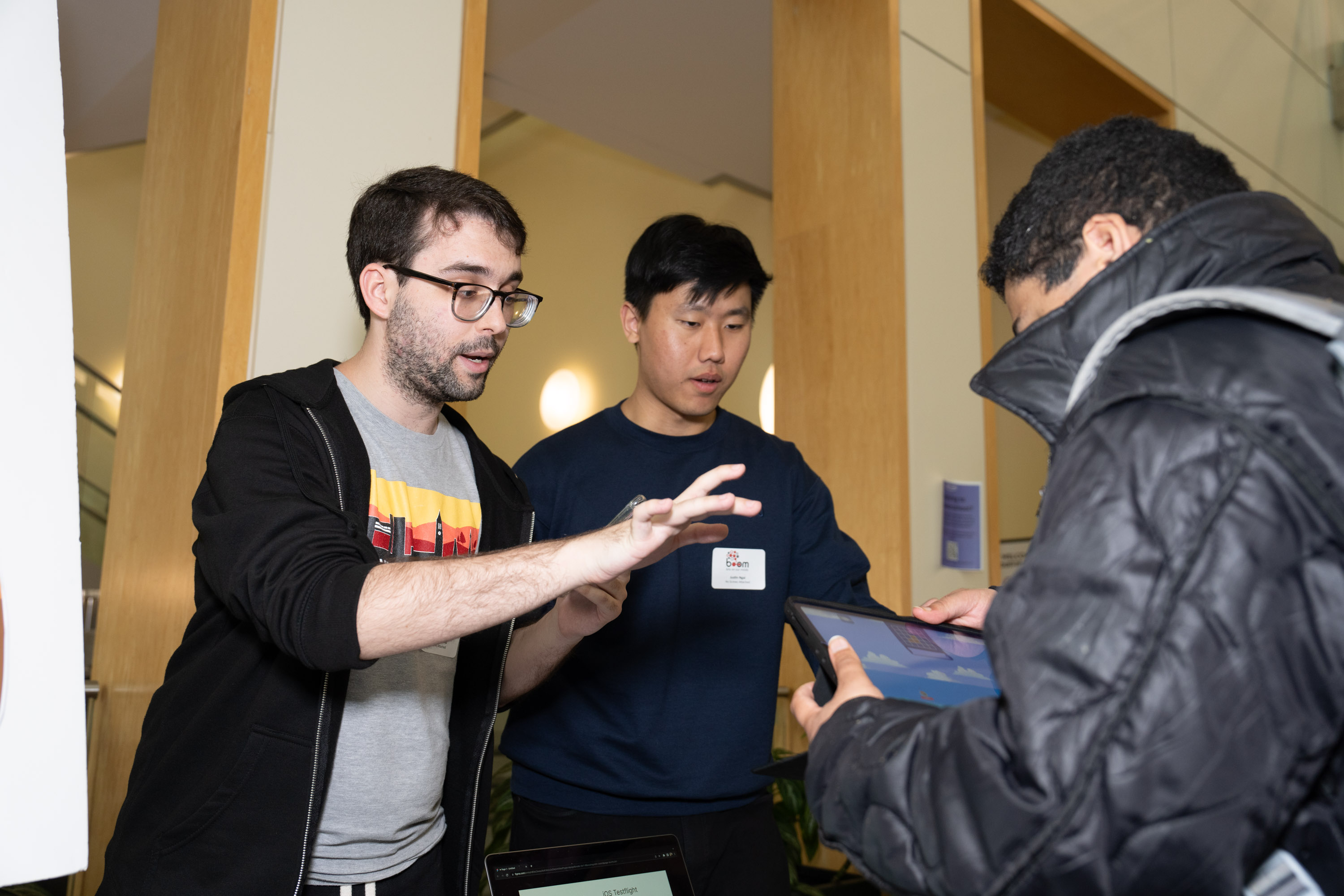 Gonzalo and Justin explaining game to a player